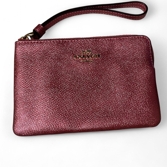 Coach Handbags - Coach Metallic Pink Leather Wristlet with Gold Logo